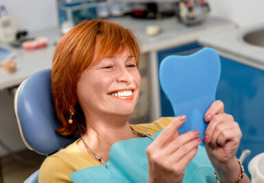 lady with tooth implant